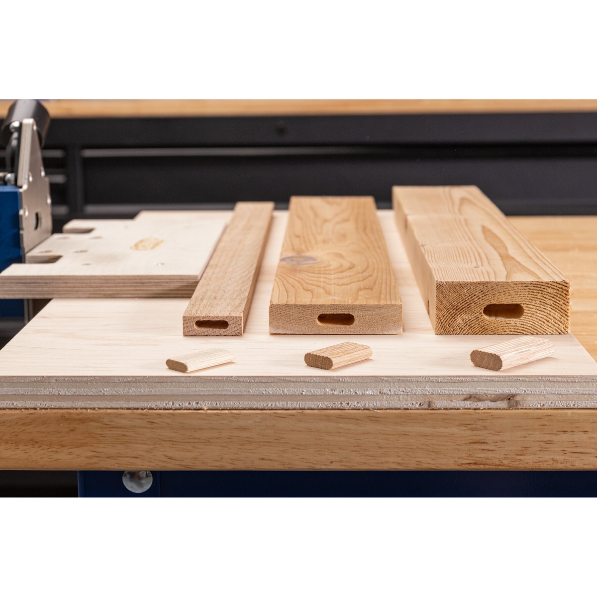 Kreg MortiseMate 8 mm Loose Tenons being inserted into a wood board during cabinet and furniture joinery setup