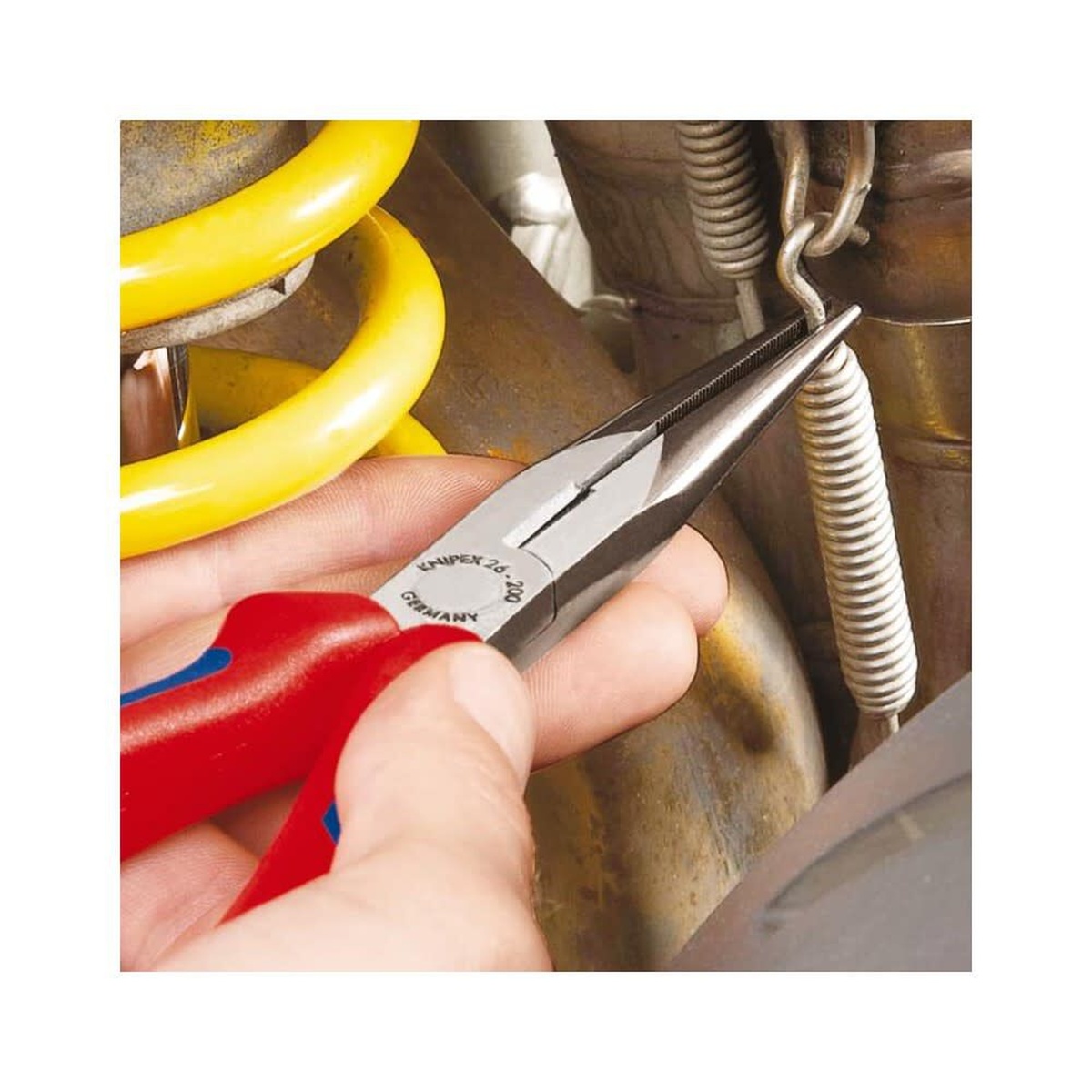 Knipex 26 12 200 Long Nose Pliers with Cutter reaching into a tight mechanical assembly to grip a spring hook during repair work