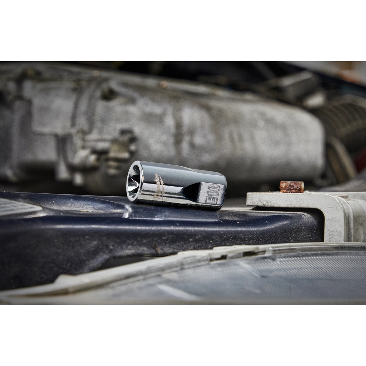 Milwaukee 48-22-9570 12pc External Torx Socket Set socket resting in an automotive engine bay during mechanical service work