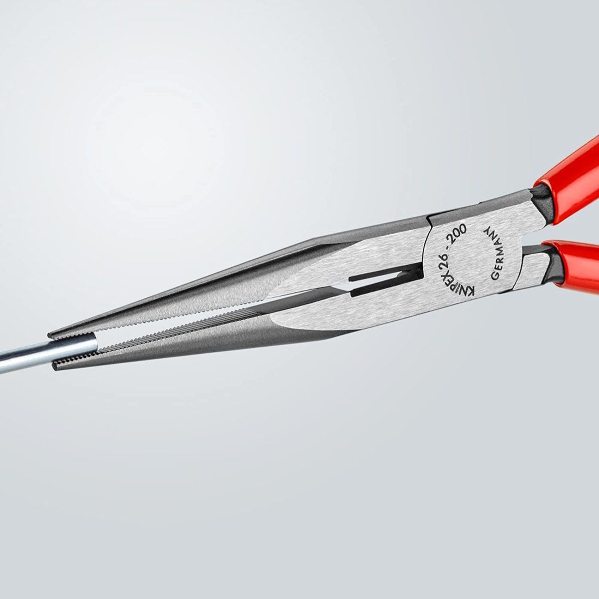 Knipex 26 11 200 SBA Long Nose Pliers with Cutter gripping wire in a tight installation space for precise alignment work