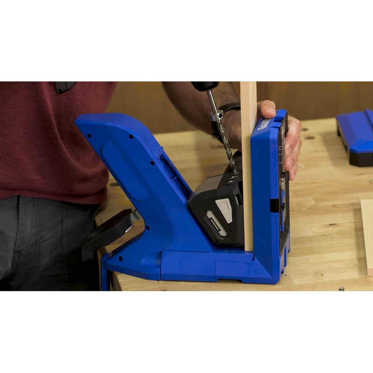 Kreg KPHA540 Micro-Pocket Drill Bit with Stop Collar and Hex Wrench drilling a compact pocket hole in thin wood stock on a woodworking bench with a Kreg pocket-hole jig