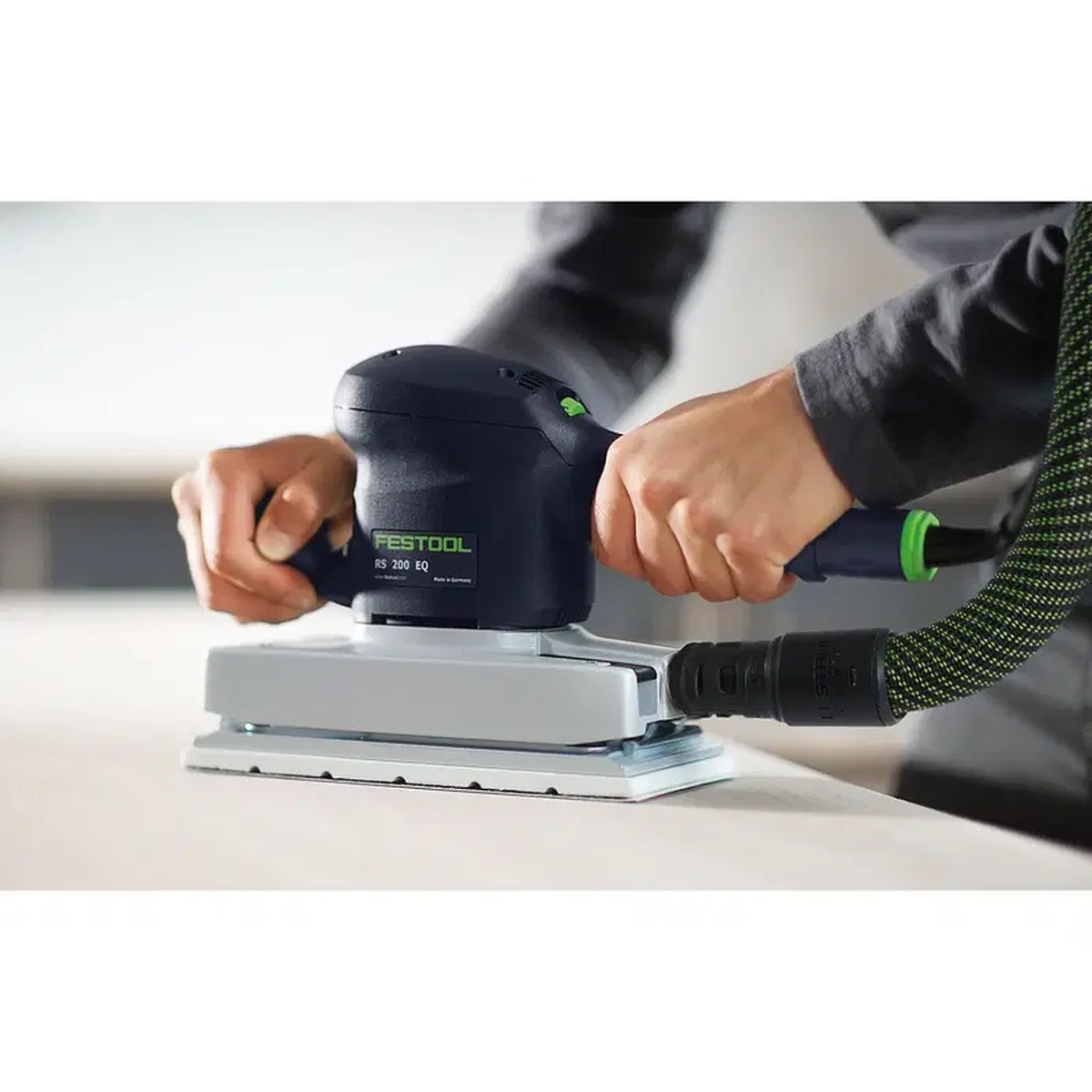 Festool Granat 115 x 228 mm P180 sanding sheet mounted on a compatible sheet sander during finish sanding on a flat work surface with dust extraction connected
