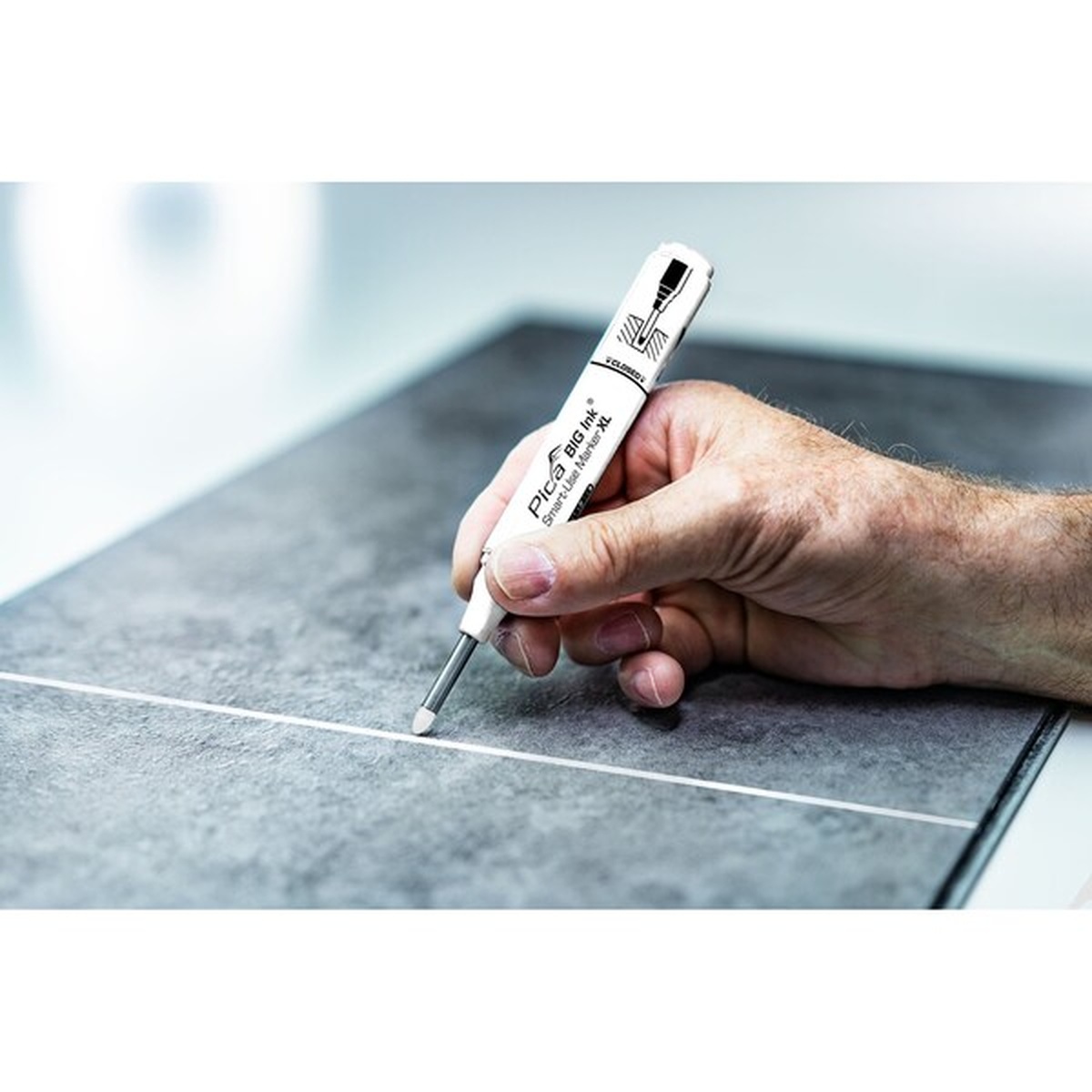 Pica Big Ink Smart-Use Marker XL white marking a tile surface during layout work