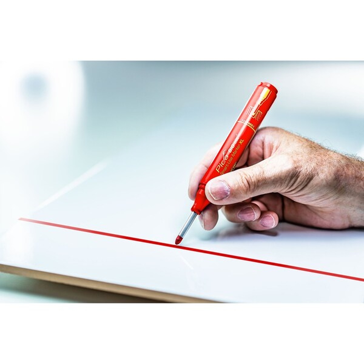 Pica 170/40/SB Red Ink Marker For Deep Hole making a clean red line on a smooth panel during layout work