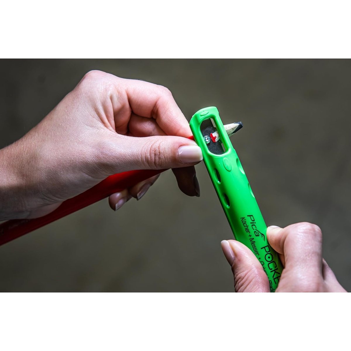 Pica 505/02 Pica Pocket carpenter pencil set with built-in sharpener being used to refine the pencil point on site