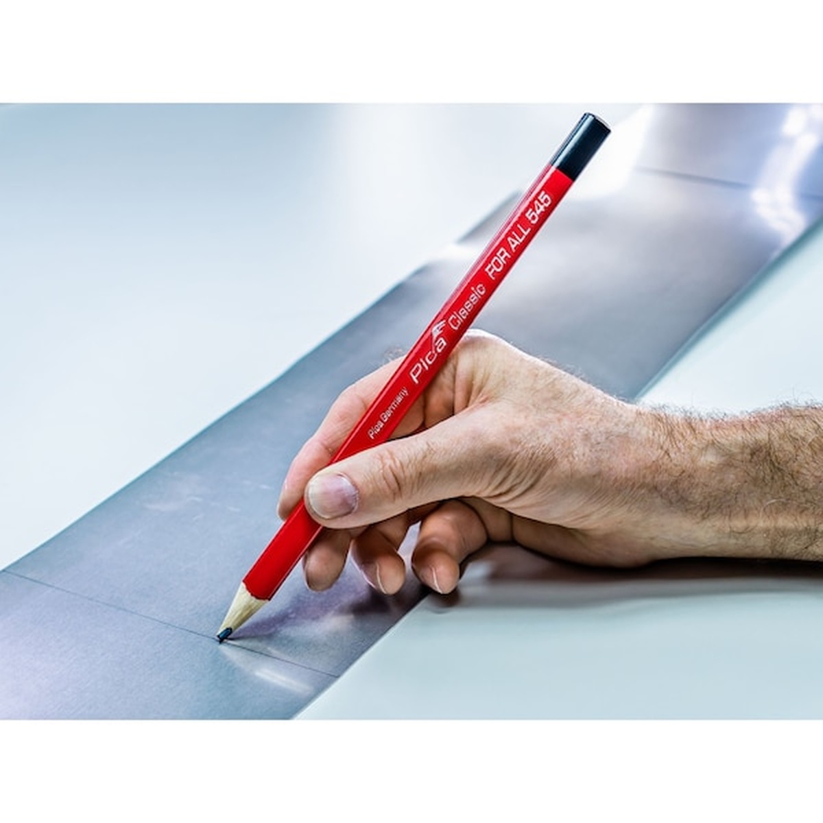 Pica Dry 505/04 Pica Pocket with Classic Universal Graphite Marking Pencil Bundle making a layout line on sheet metal in a workshop setting