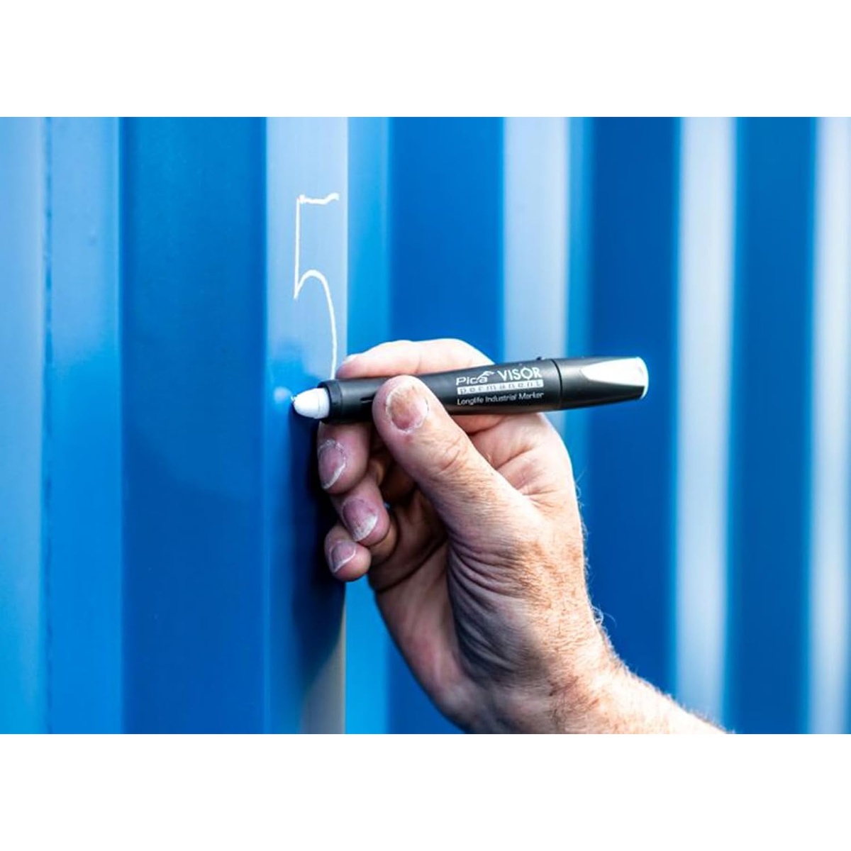 Pica 990/40/SB Visor Permanent Marker making a visible mark on a blue metal panel during industrial layout work