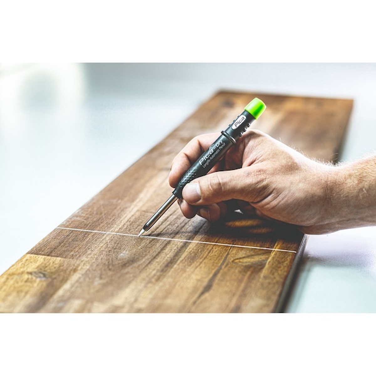 PICA 4043 Dry White Refill Leads, 10-Pack making layout marks on finished wood with a Pica Dry automatic pencil on a workbench