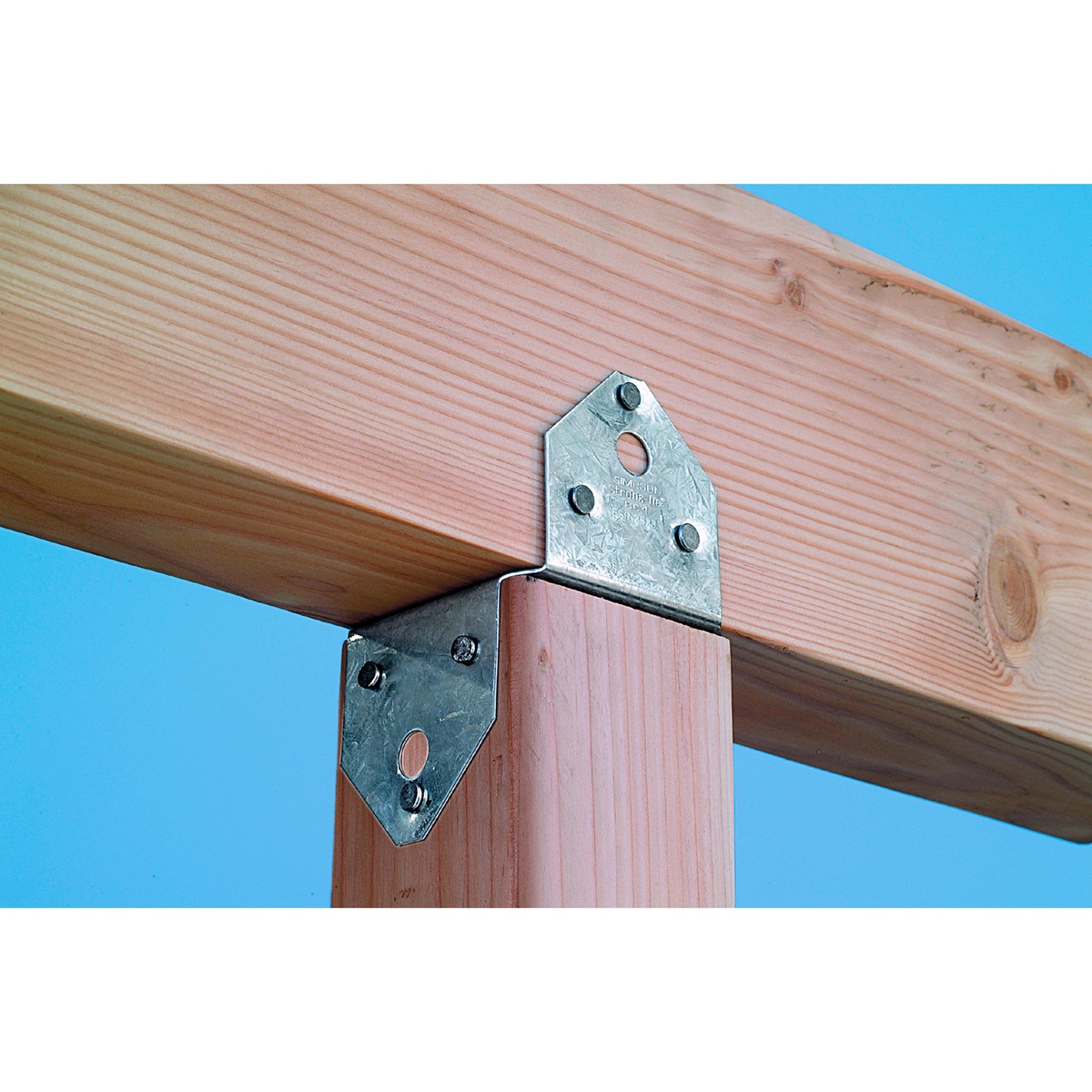 Simpson Strong-Tie BC46 Post Cap installed between a wood beam and wood post in a deck framing application