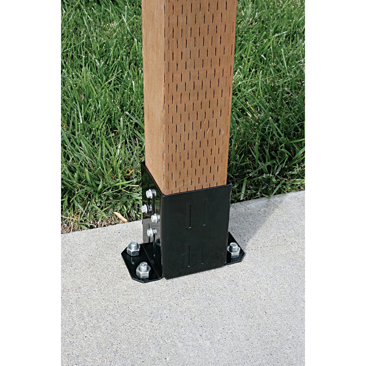 Simpson Strong-Tie FPBB44 E-Z Base post base mounted to concrete around a 4x4 wood post for outdoor fence and post support work