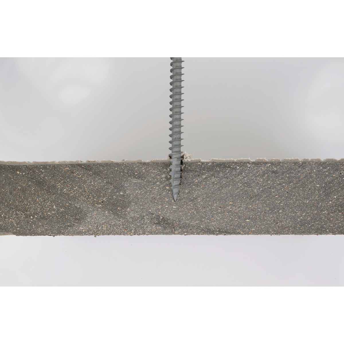Simpson Strong-Tie Deck-Drive DCU COMPOSITE Screw, #10 x 2-3/4-in. T20, Quik Guard, Tan 01, 70-Pack showing the Type-17 point and thread profile in a composite board cutaway