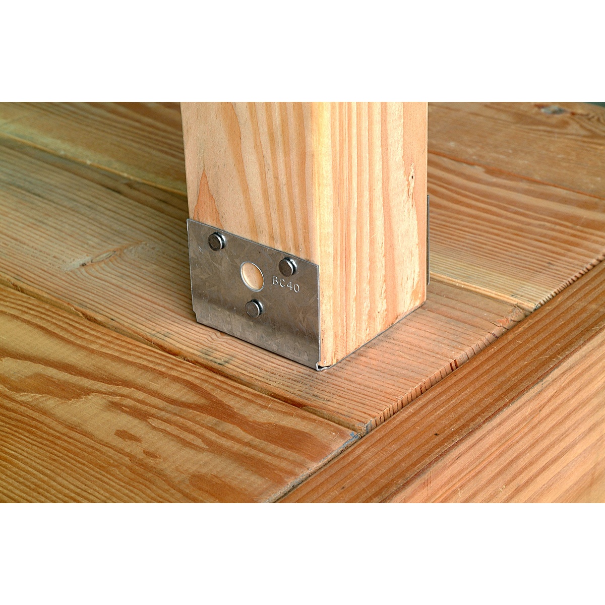 Simpson Strong-Tie BC40Z Post Base installed around a 4x wood post on deck framing in an outdoor wood construction setting