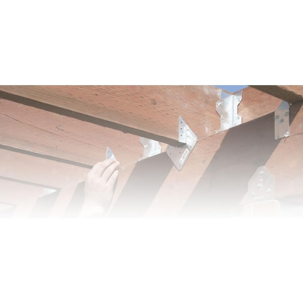 Simpson Strong-Tie ZMAX Galvanized Post Cap for 4x BC4Z-R installed on wood framing under a deck beam in an exterior construction setting