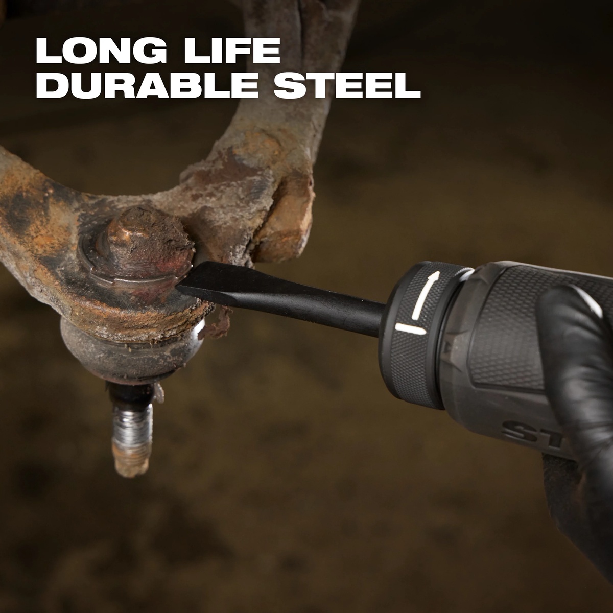 Milwaukee 5-Piece Hammer Chisel Bit Set flat chisel removing a rusted automotive part during metal repair work