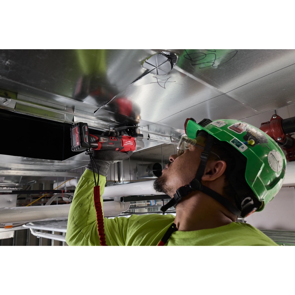 Milwaukee M12 FUEL 16 Gauge Scroll Shear Replacement Blade Set used with a Milwaukee scroll shear for overhead sheet metal cutting in commercial HVAC work