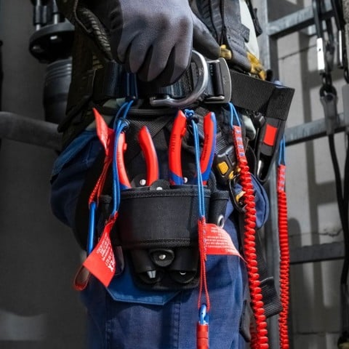 Knipex 13 72 8 Forged Wire Stripper 20-10 AWG carried on a tool belt with a tether system for working at height