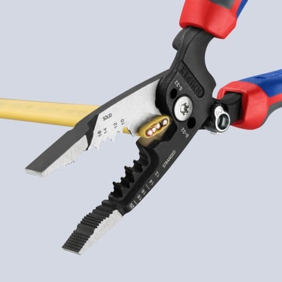 Knipex 13 72 8 Forged Wire Stripper 20-10 AWG stripping electrical wire close-up showing the stripping holes and cutting edges