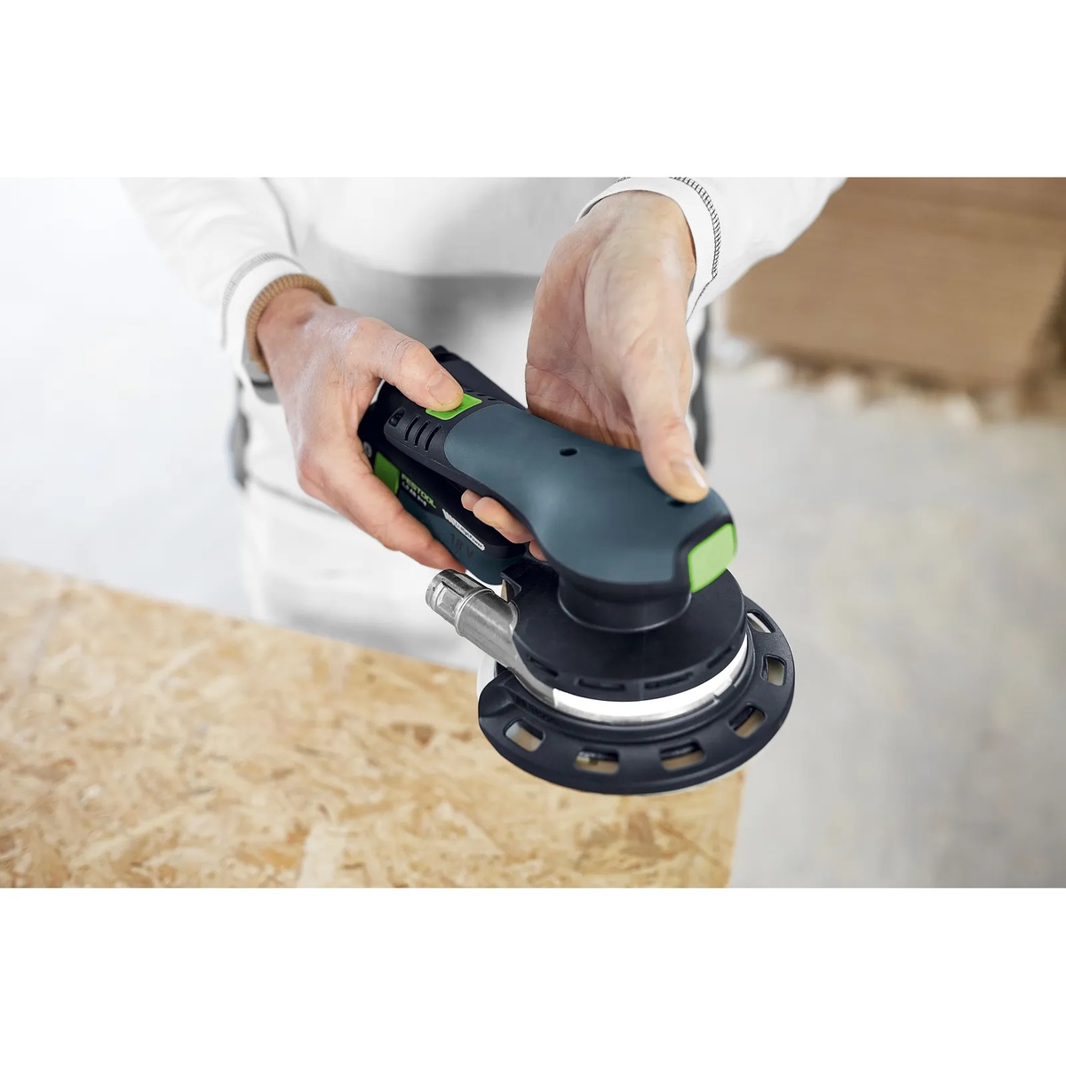 Festool PR ETSC 2 150 Protector for ETSC 2 150 Cordless Orbital Sander installed on a sander while working near the edge of an OSB panel in a shop setting