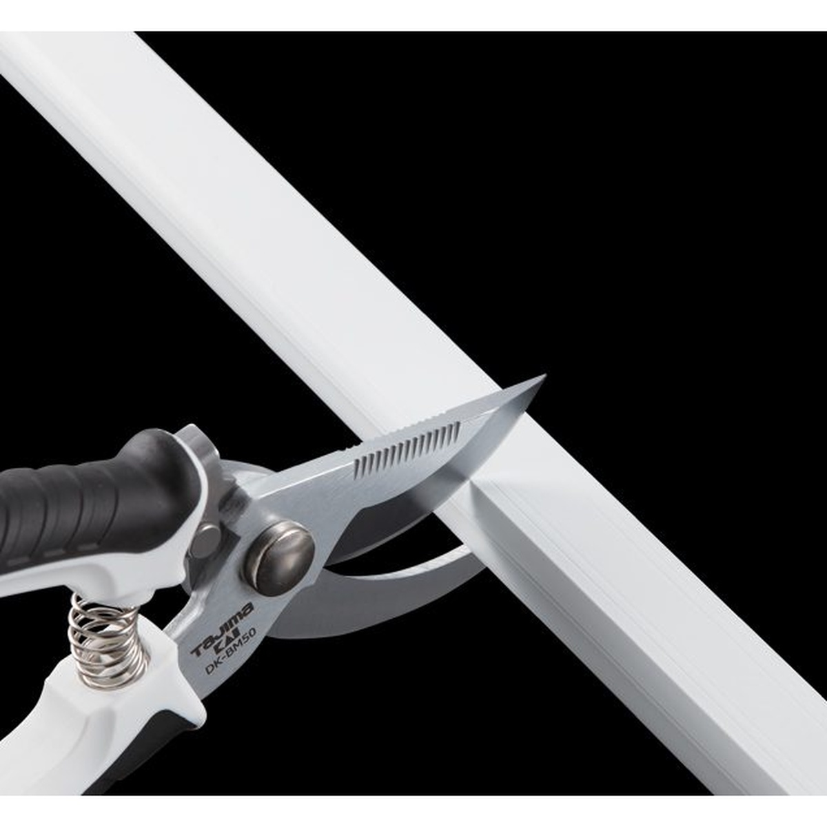 Tajima VARIX Smooth Cut Snips cutting plastic wire molding during electrical installation work for a clean finish edge