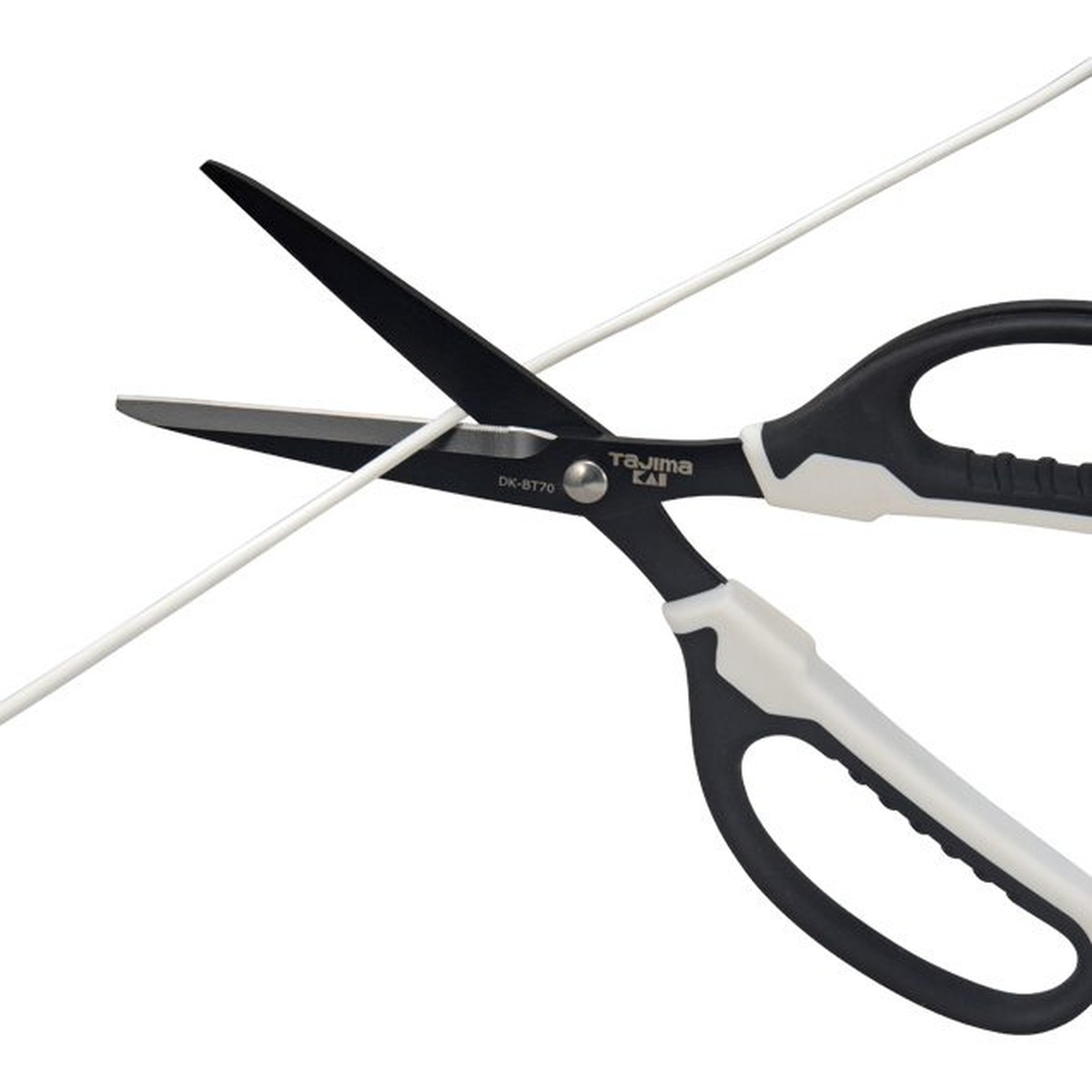 Tajima DK-BT70 VARIX Non-Stick Scissors cutting thin wire in a close-up application shot for electrical and installation work