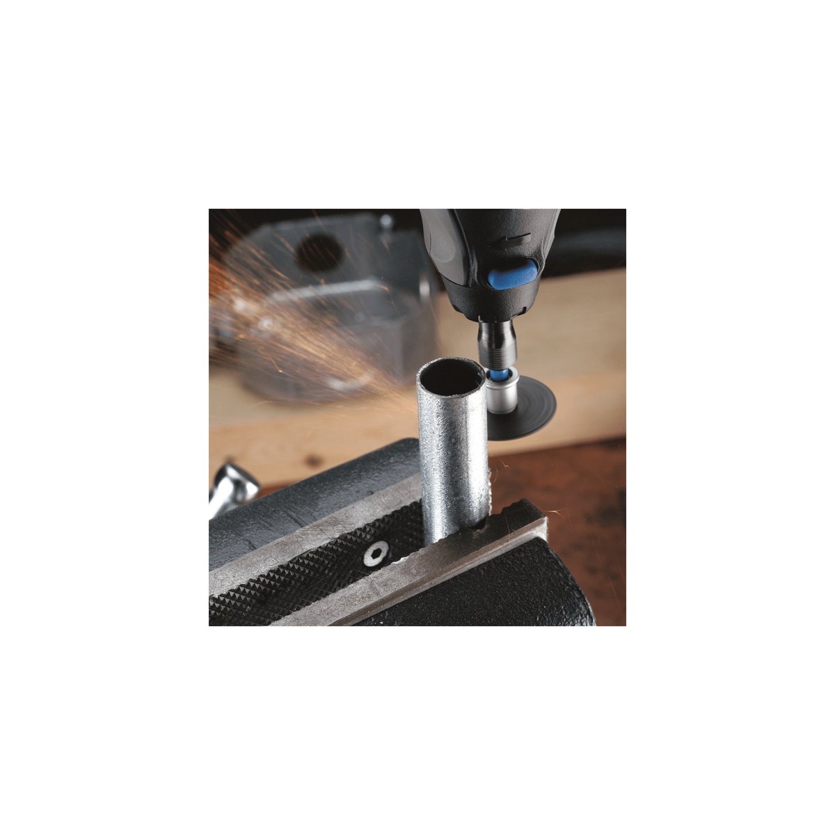 Dremel EZ728-01 11 PC EZ Lock Cutting Rotary Accessories Micro Kit cutting a metal tube with a rotary tool on a workbench during fabrication work