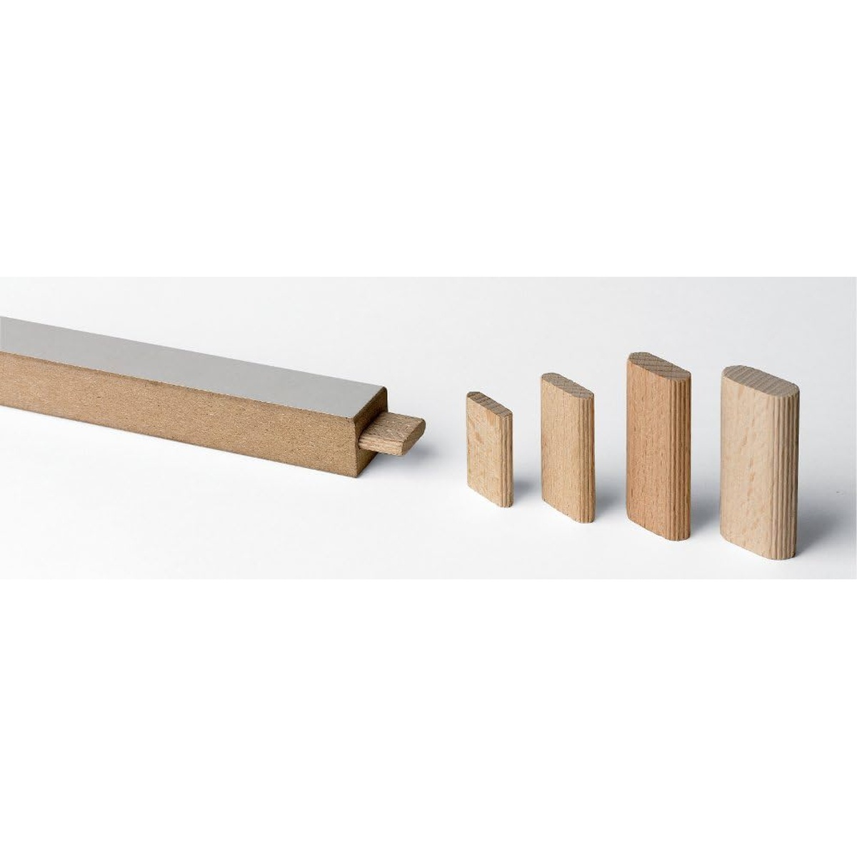 CMT 380.101.11 Domino joiner bit used for loose-tenon wood joinery, showing Domino tenons and a mortised wood workpiece in a woodworking setup
