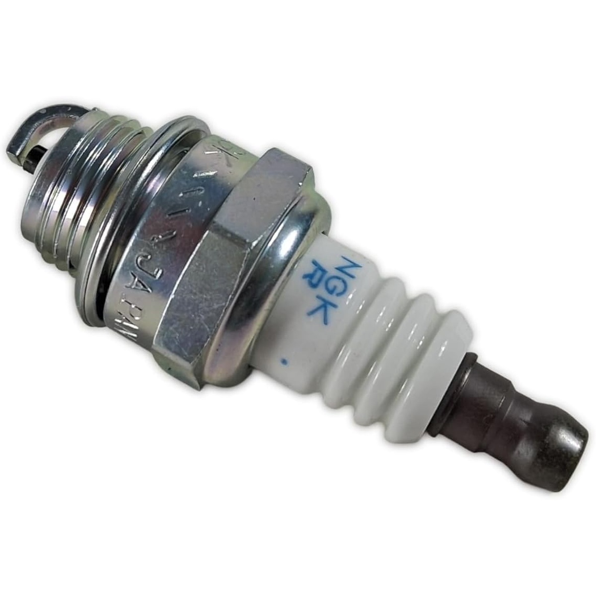 Husqvarna 546903002 Service Kit spark plug close-up for tune-up service on K970 and K1270 series power cutters