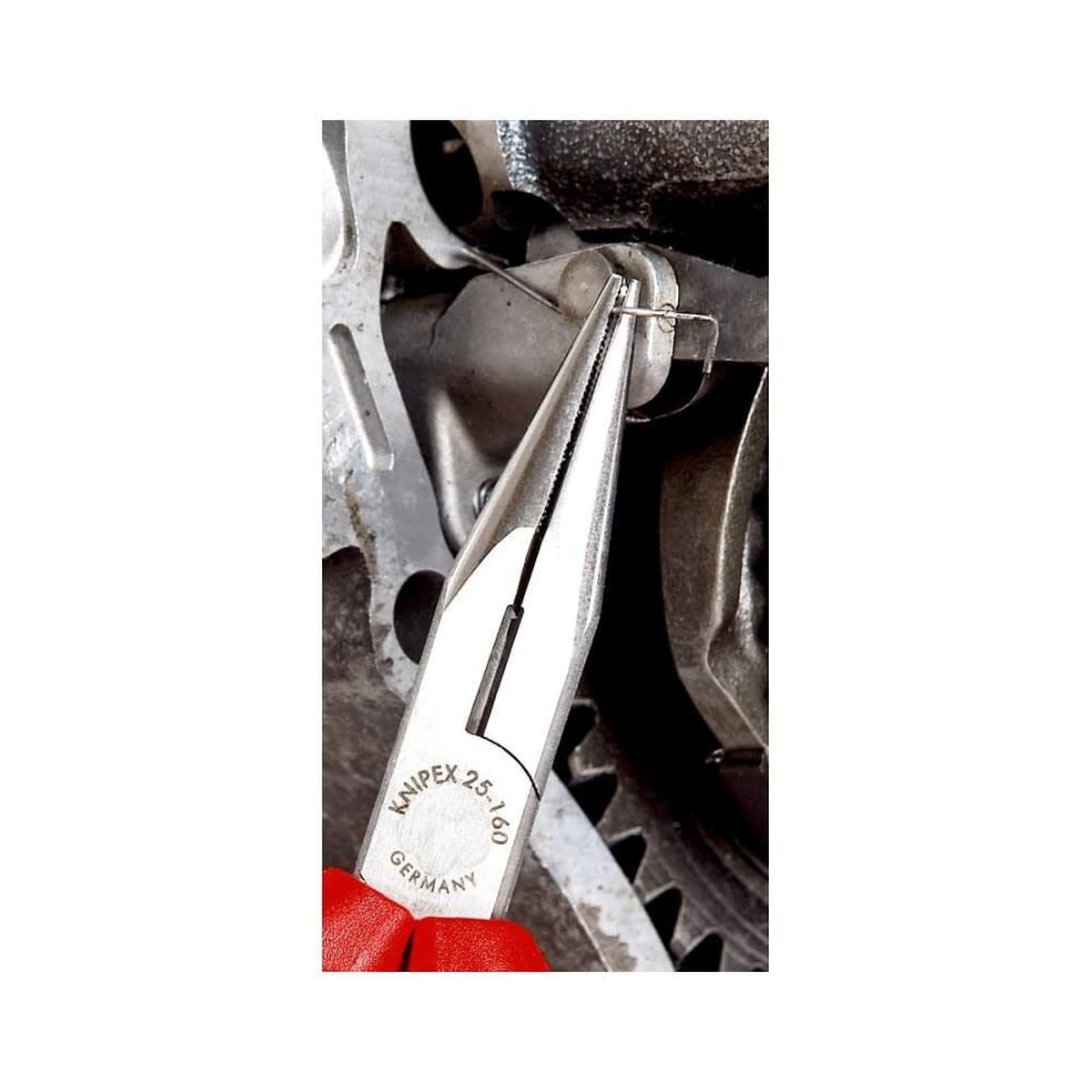 Knipex Cutting Pliers Snipe Nose Side 160 mm gripping a small metal wire clip inside a tight mechanical assembly