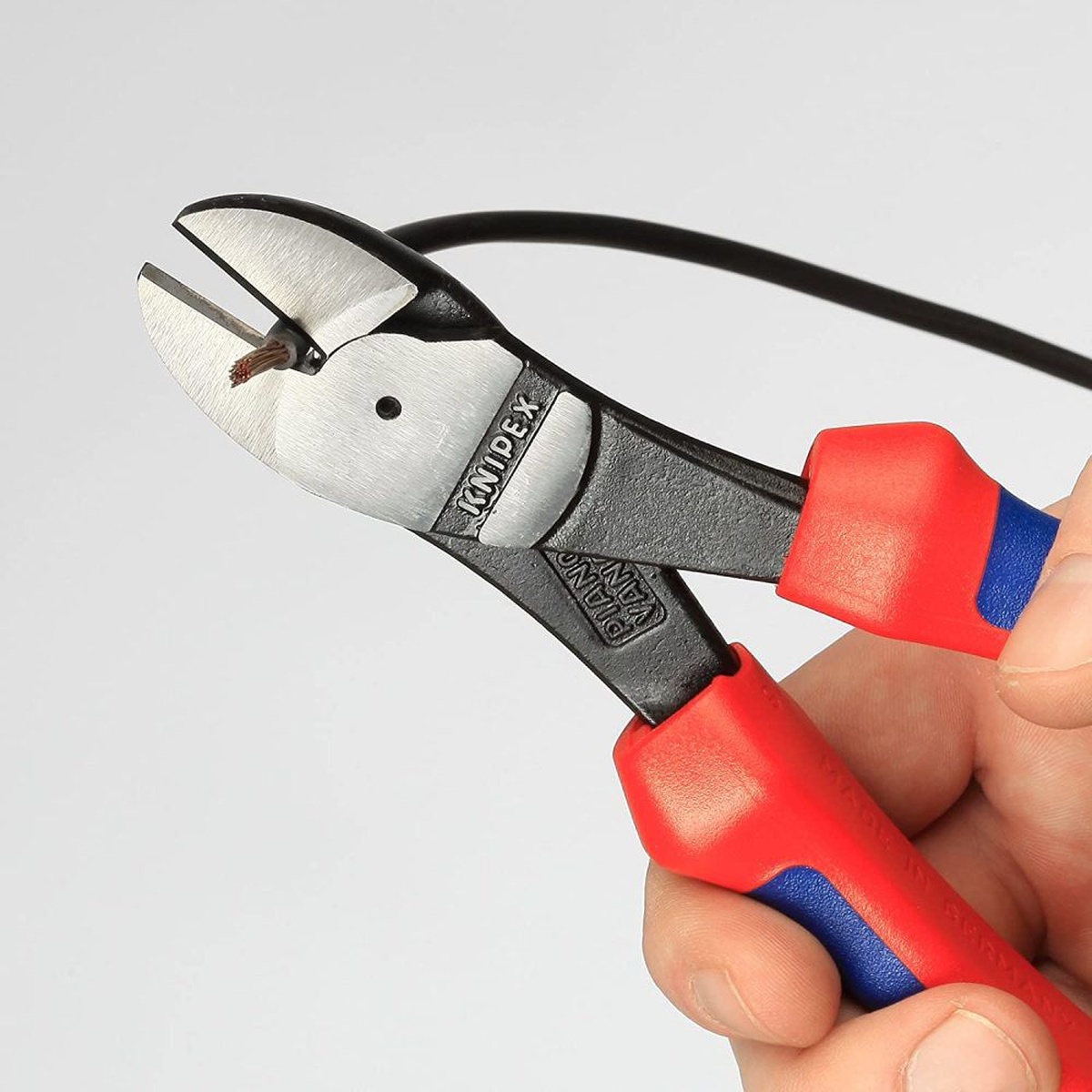 Knipex Diagonal Cutter Multi Component Grip 250mm close-up cutting wire to show hardened cutting edges and jaw control