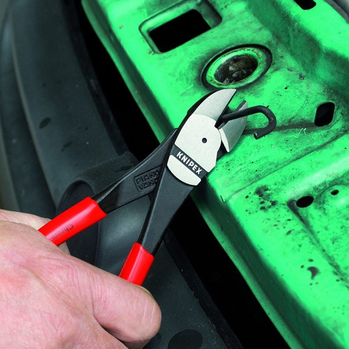 Knipex 74 21 250 SBA High Leverage Diagonal Cutters cutting wire in a tight metal panel area during service work