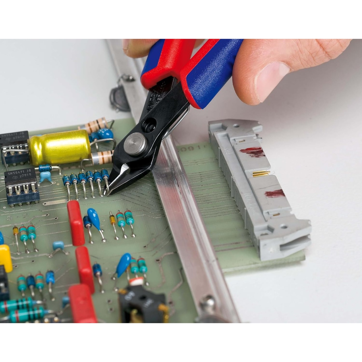Knipex 78 61 125 SBA Electronics Super Knips cutting component leads on a populated circuit board during precision electronics repair