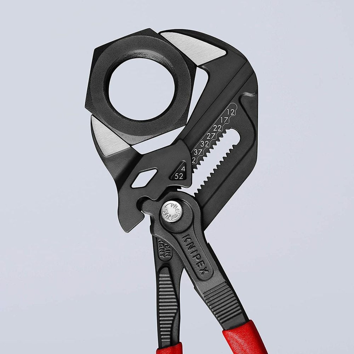 Knipex Black Atramentized Pliers Wrench 250mm adjusted around a large hex nut to show 2 inch jaw capacity in fastening work