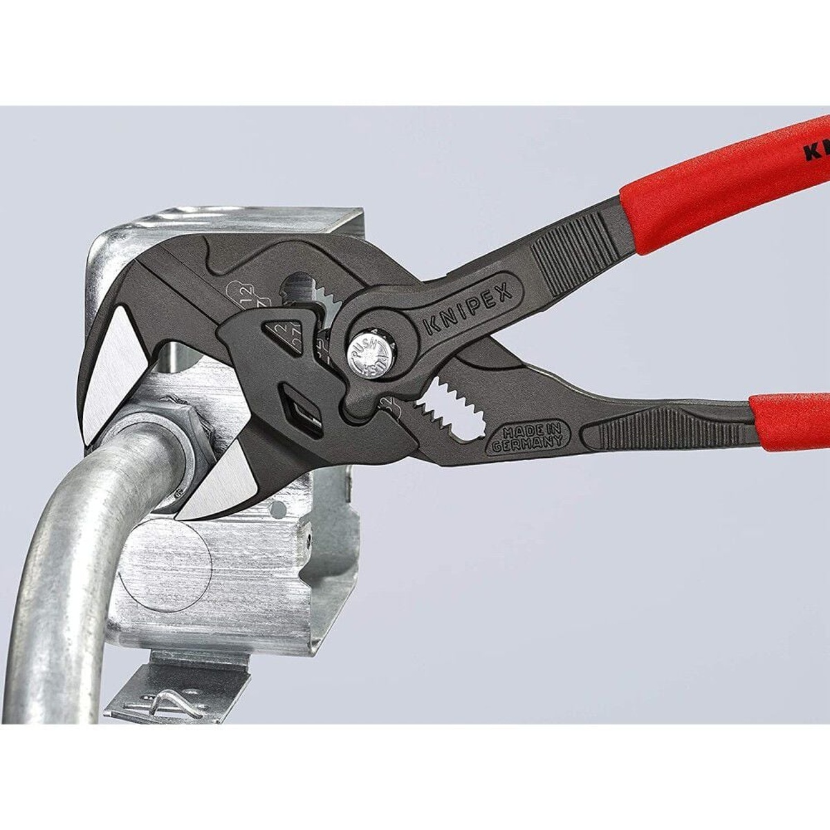 Knipex Black Atramentized Pliers Wrench 250mm gripping a metal conduit fitting during installation work on finished hardware