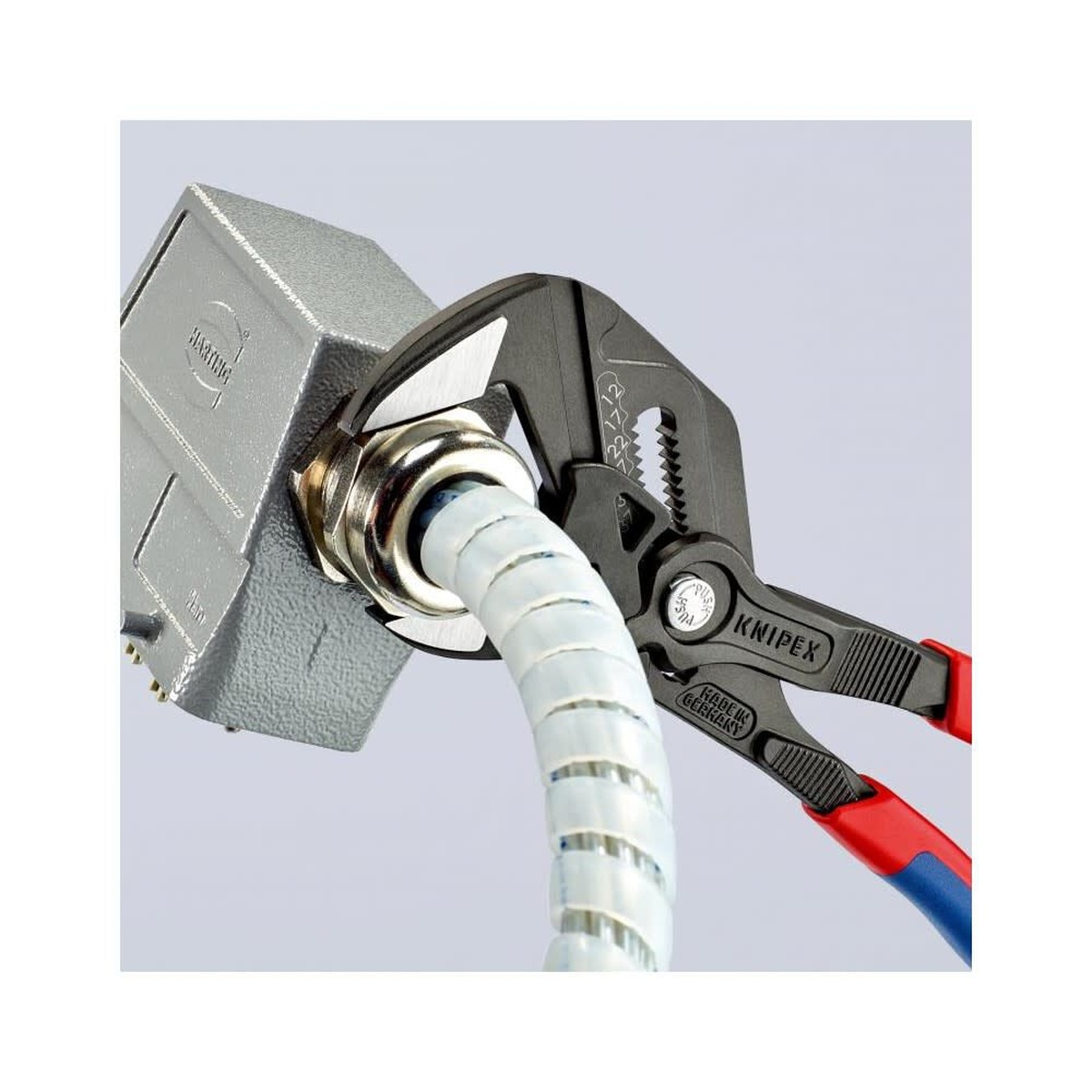 Knipex Adjustable Pliers Wrench 250mm gripping a finished fitting on a flexible conduit connection during installation work