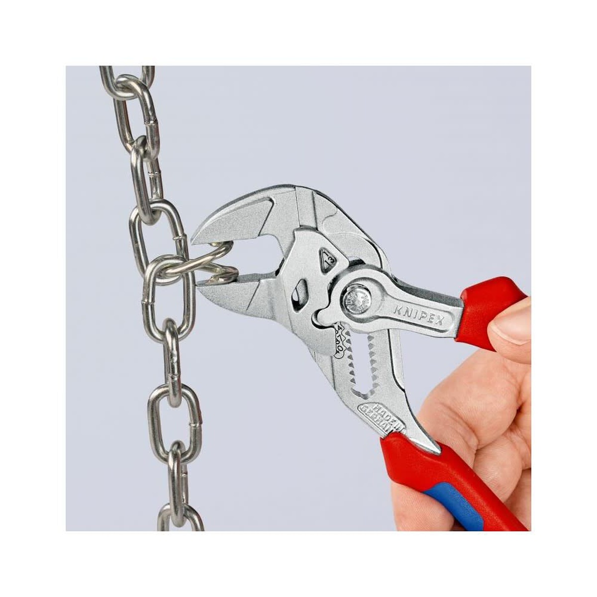 Knipex Chrome Plated Head Pliers Wrench 180mm holding chain links during precise gripping work in a maintenance setting