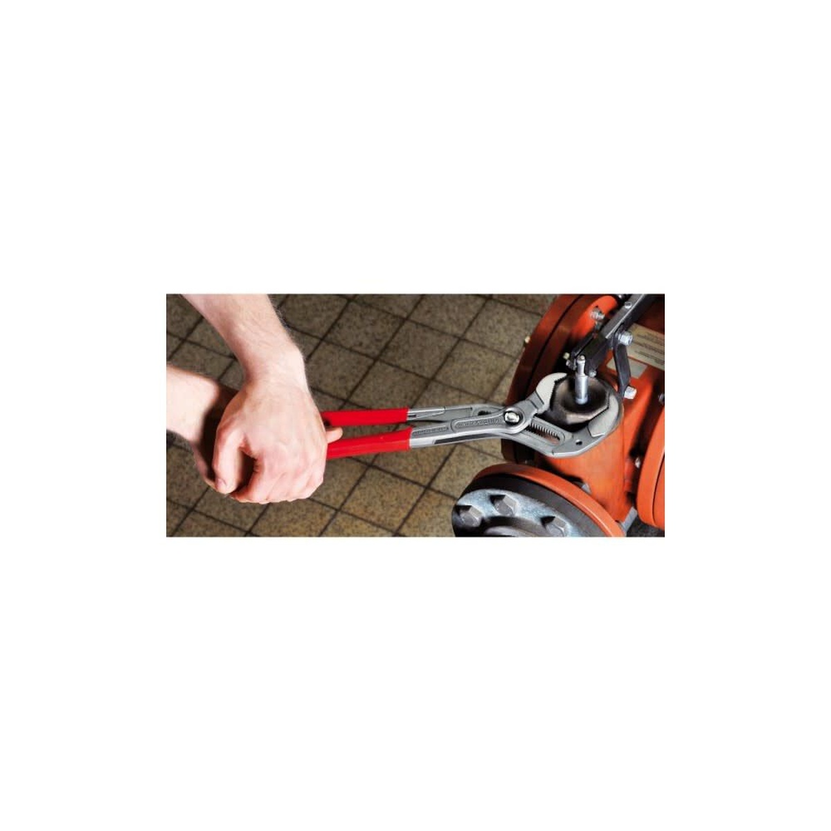 Knipex Cobra XL Water Pump Pliers 400mm gripping a large valve fitting during plumbing and mechanical service work