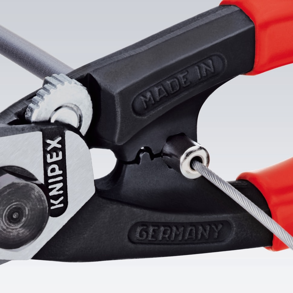 Knipex wire rope cutter crimping an end ferrule onto cable during cable assembly work