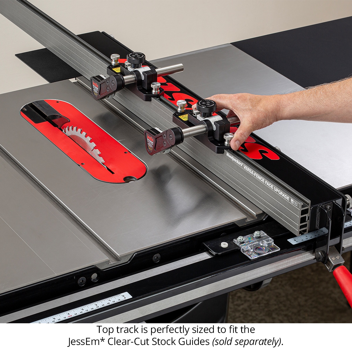 Woodpeckers Versa-Fence Face Upgrade for SawStop table saw with stock guides mounted on the top track for ripping work in a shop