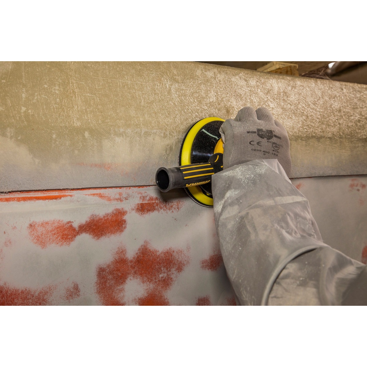 Mirka MR-610TH Two-Handed Vac-Ready Sander used with side handle on vertical panel sanding work in a production environment