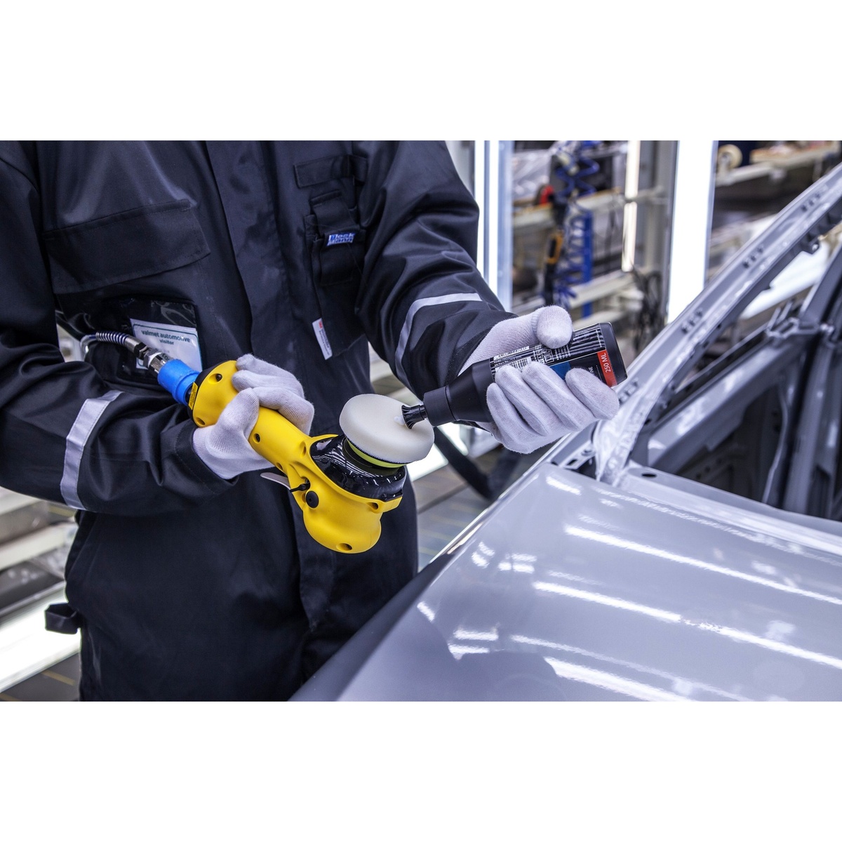 Mirka MROP-312TH 3 inch Two-Handed Orbital Polisher being prepared for automotive polishing work on a vehicle body panel in a refinishing shop
