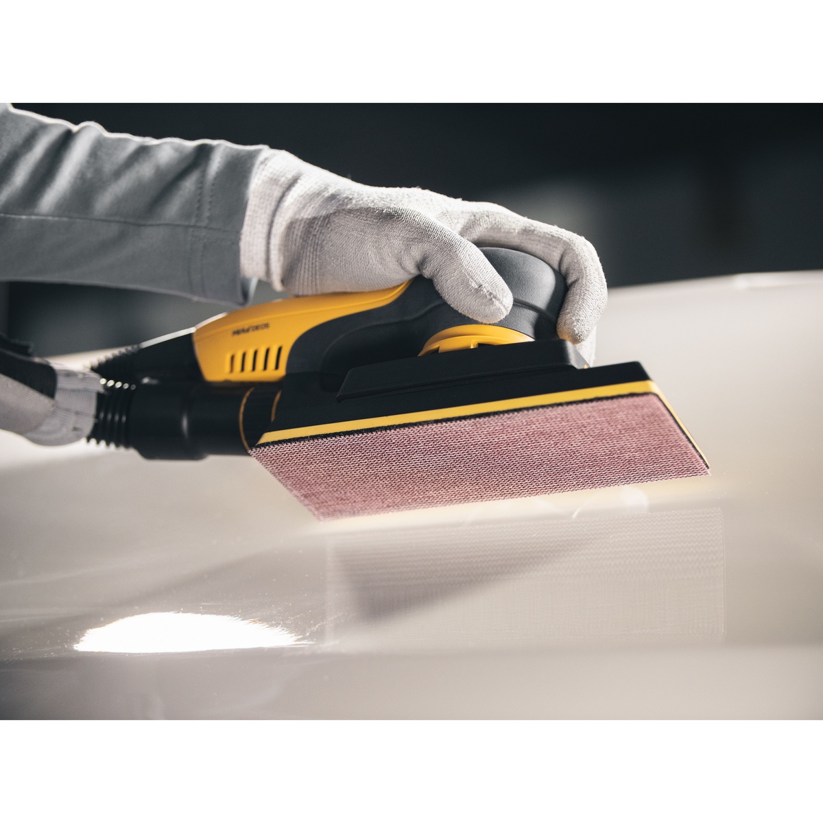 Mirka ABRANET 4.5 x 32.8 foot grip sanding roll installed on a rectangular sander for smooth surface finishing on coated material in shop use