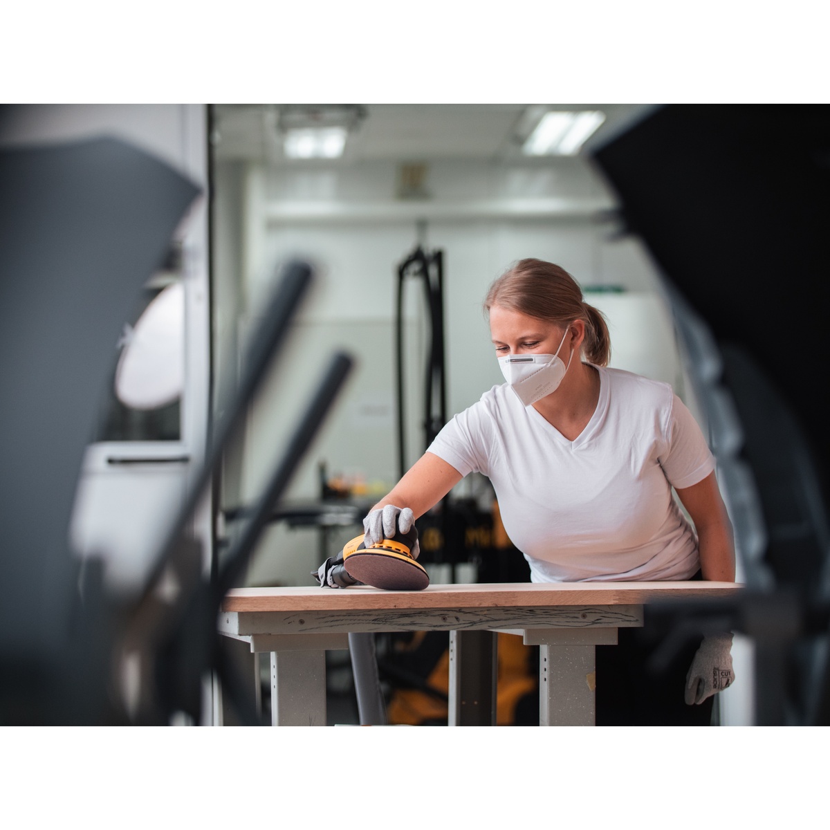 Mirka ABRANET 11 inch Grip sanding disc used on a wood panel during surface prep in a workshop