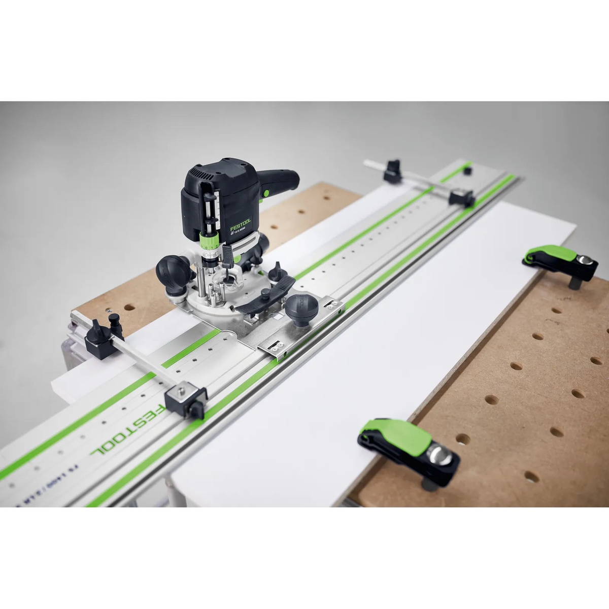 Festool 576799 LR 32 Hole Drilling Set for OF1010 & OF1400 Routers in Systainer3 installed on a Festool router and hole line guide rail, drilling cabinet panel holes on a workbench for frameless casework
