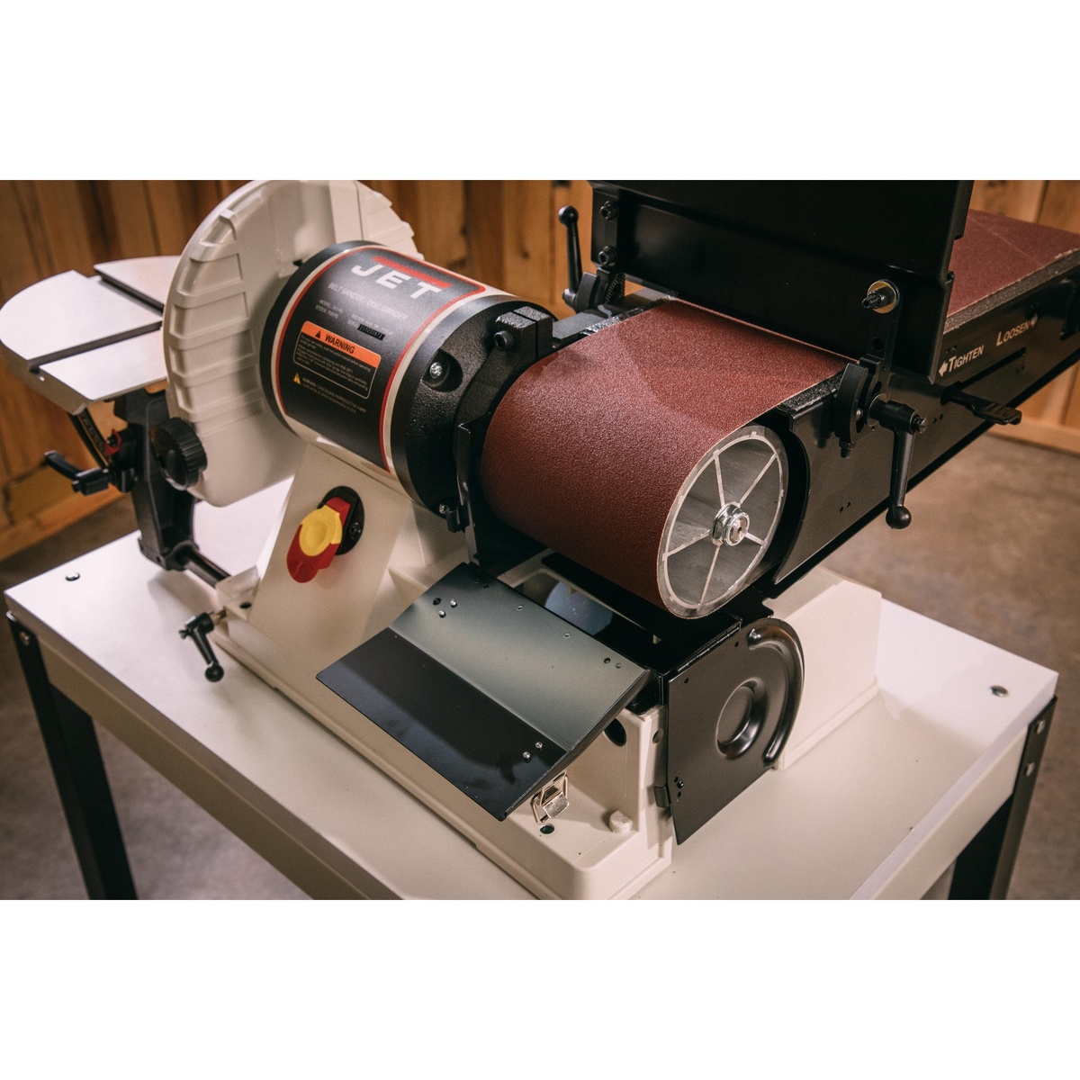 Jet 708597K JSG-96CS belt and disc sander showing the 6 x 48 belt, 9 inch disc area, and work tables in a woodworking shop setting
