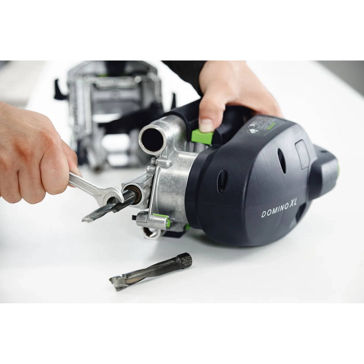 Festool 497871 Domino XL Cutter 14mm being installed in a Festool DOMINO XL DF 700 joiner during cutter change setup on a woodworking bench