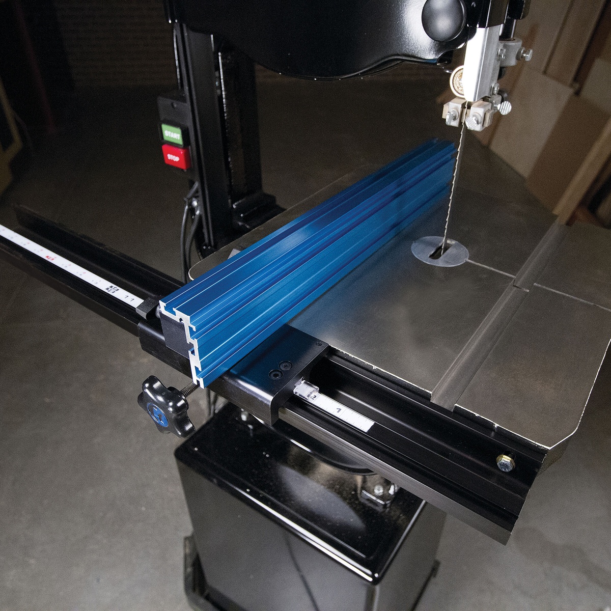 Kreg Tool KMS7200 Precision Band Saw Fence installed on a band saw table for straight ripping and resawing setup in a woodworking shop