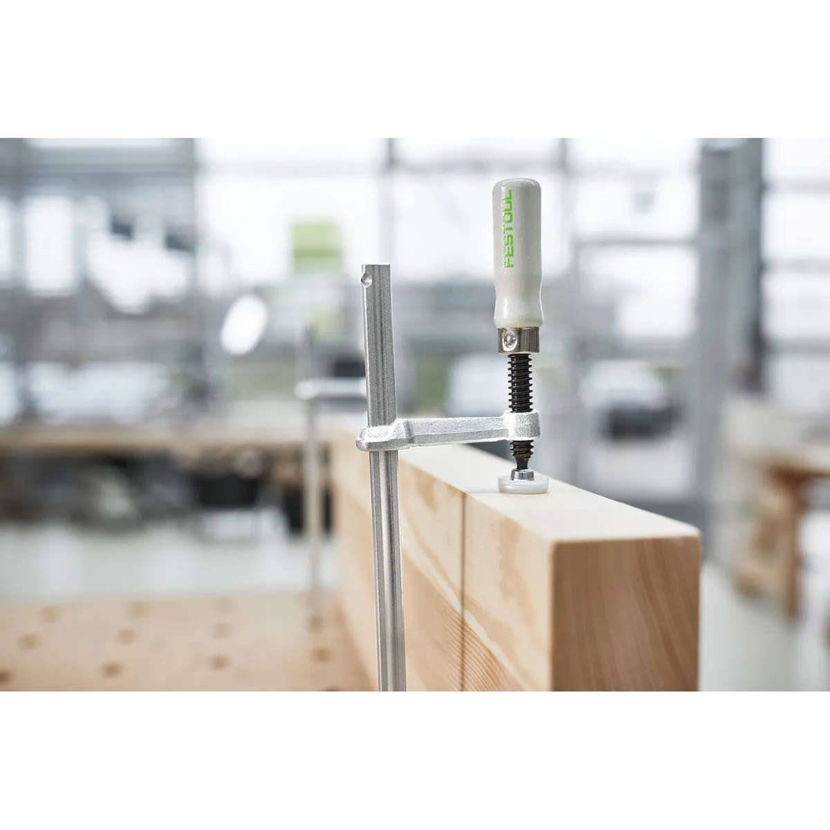 Festool FSZ 300 Screw Clamps securing a wood workpiece on a Festool MFT table for precision woodworking in a shop setting