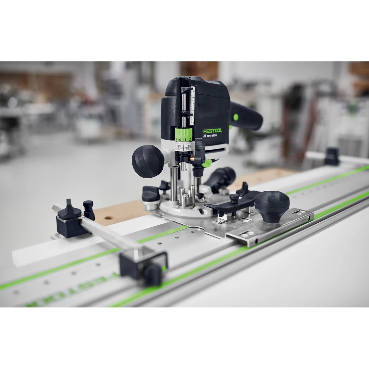 Festool 583290 LR 32 Hole Drilling Set in use with a Festool OF 1010 router on a guide rail for cabinet shelf support drilling