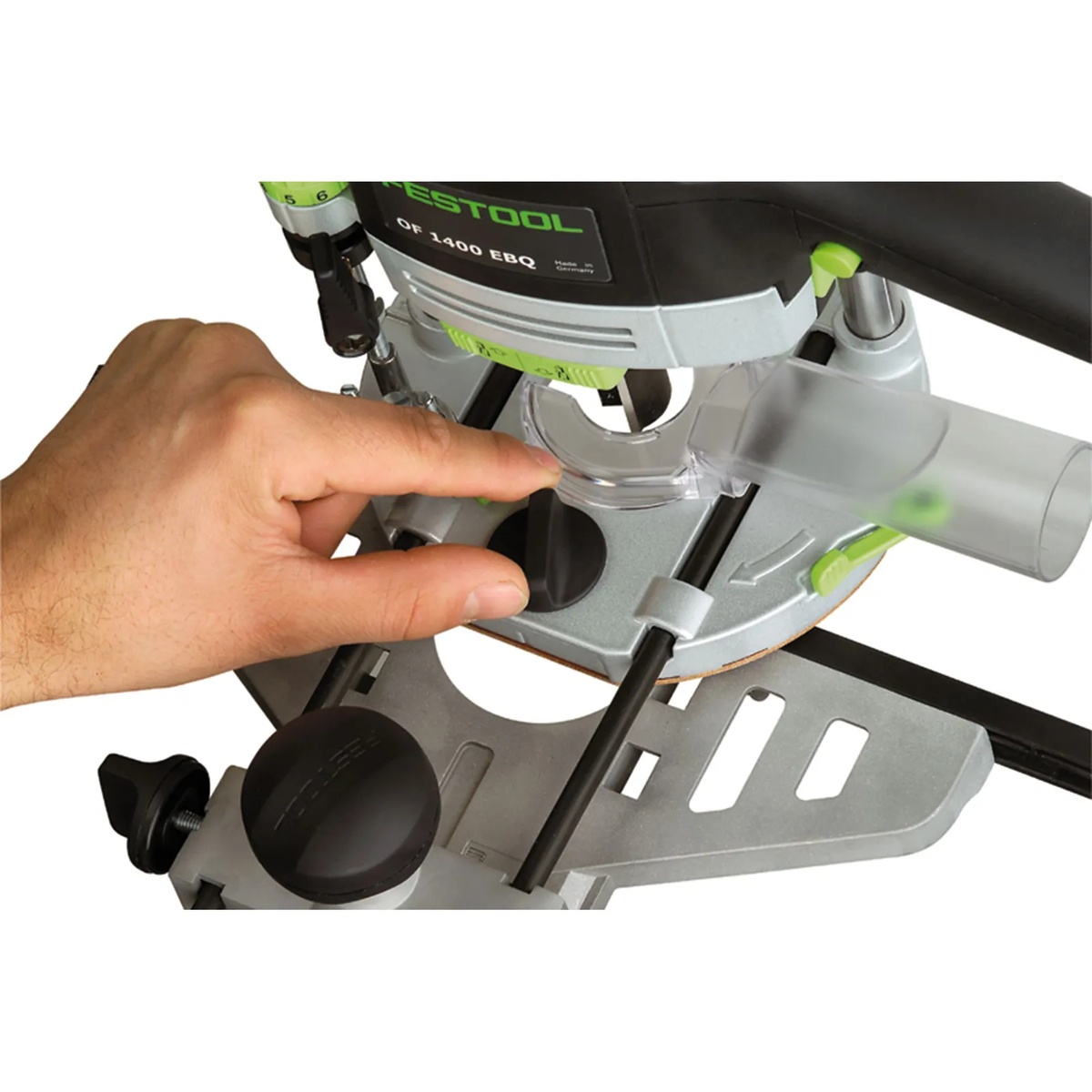 Festool Edge Guide OF 1400 installed on a Festool OF 1400 router with dust hose attached during edge-routing setup on a workpiece