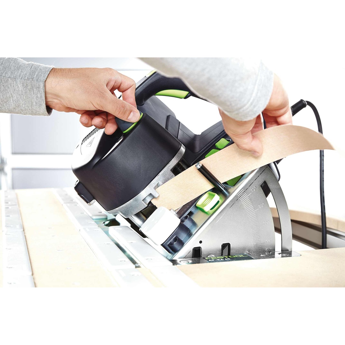 Festool 500869 MFT/3 CONTURO Edge Bander Table holding a CONTURO edge bander while edge banding a narrow panel on a shop work surface